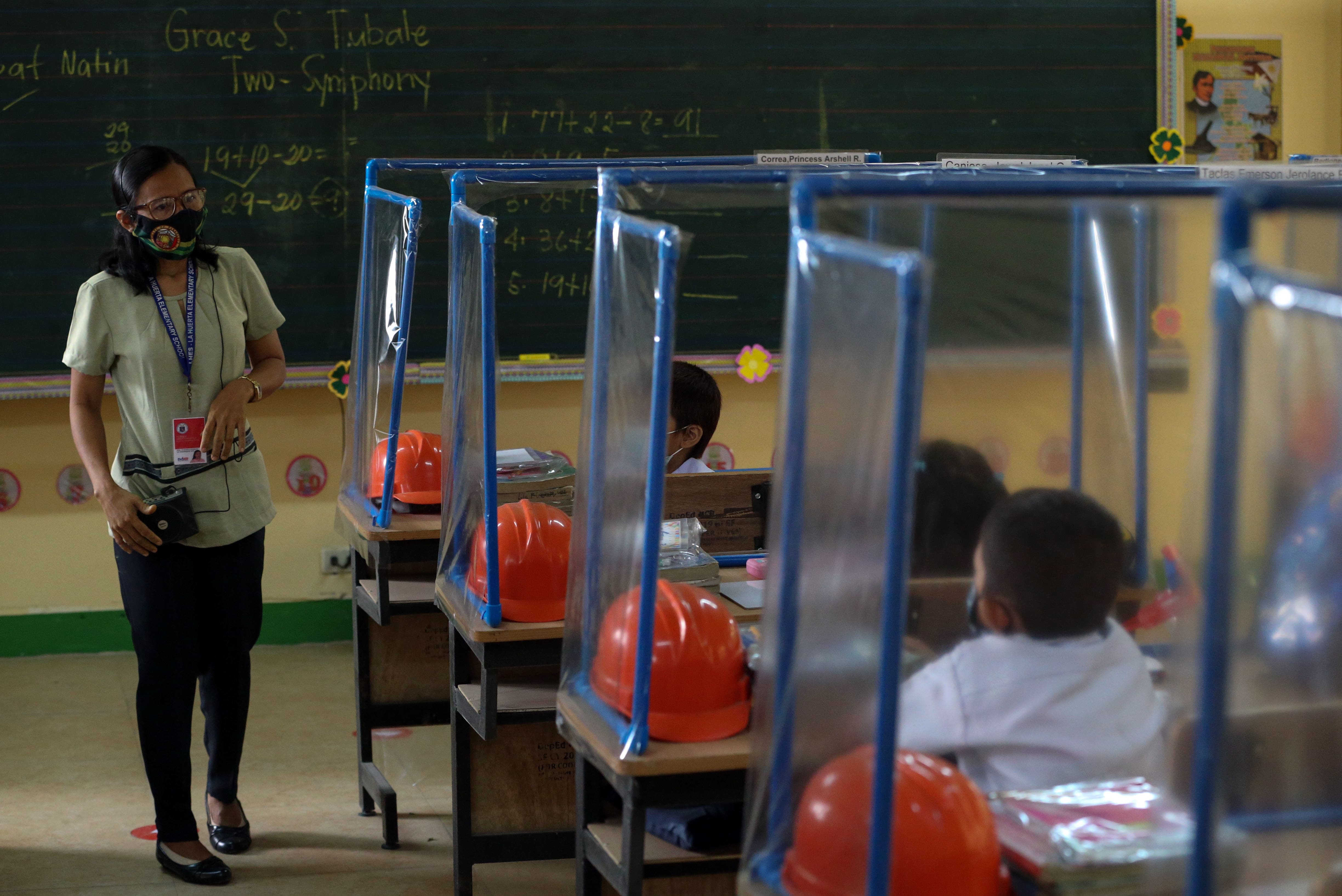 Students attend their first day of limited face-to-face classes at the La Huerta Elementary School in Parañaque City. (KJ Rosales/The Philippine Star)